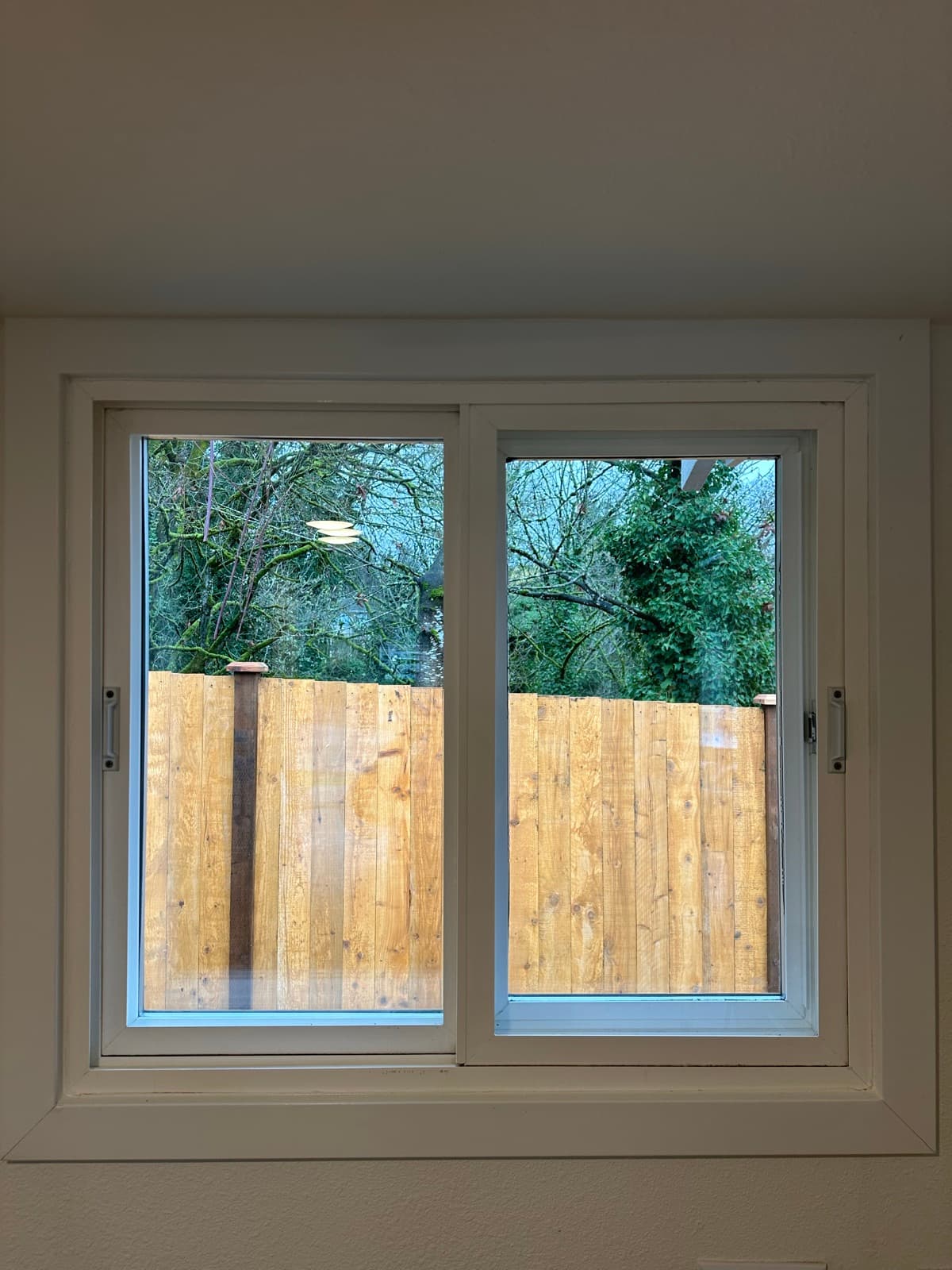 Post-Construction in Renton, WA — Window after cleaning: Boards removed, glass clear, view restored