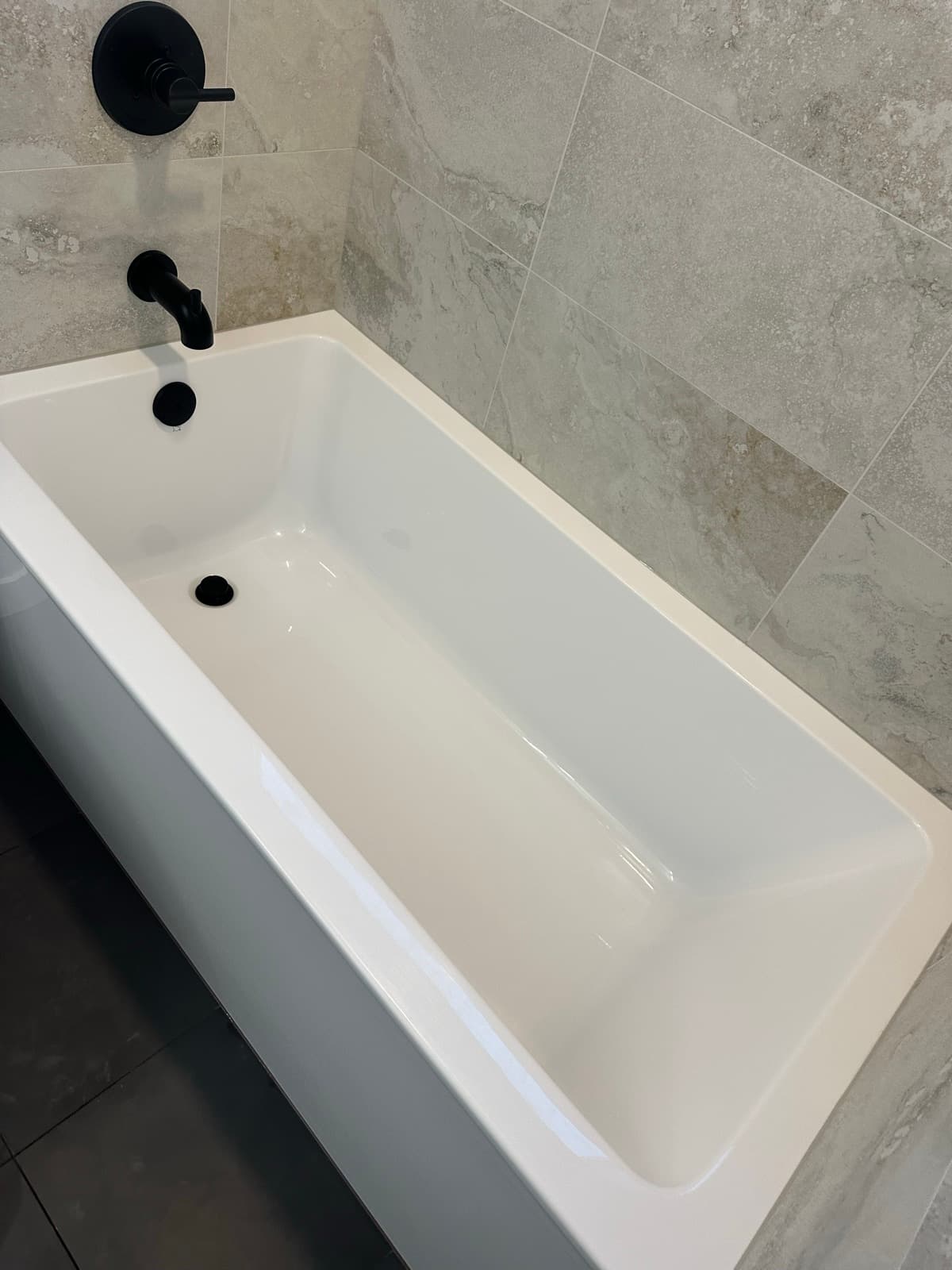Home Cleaning in Auburn, WA — Bathroom after cleaning: Bright white finish, fresh-looking tub