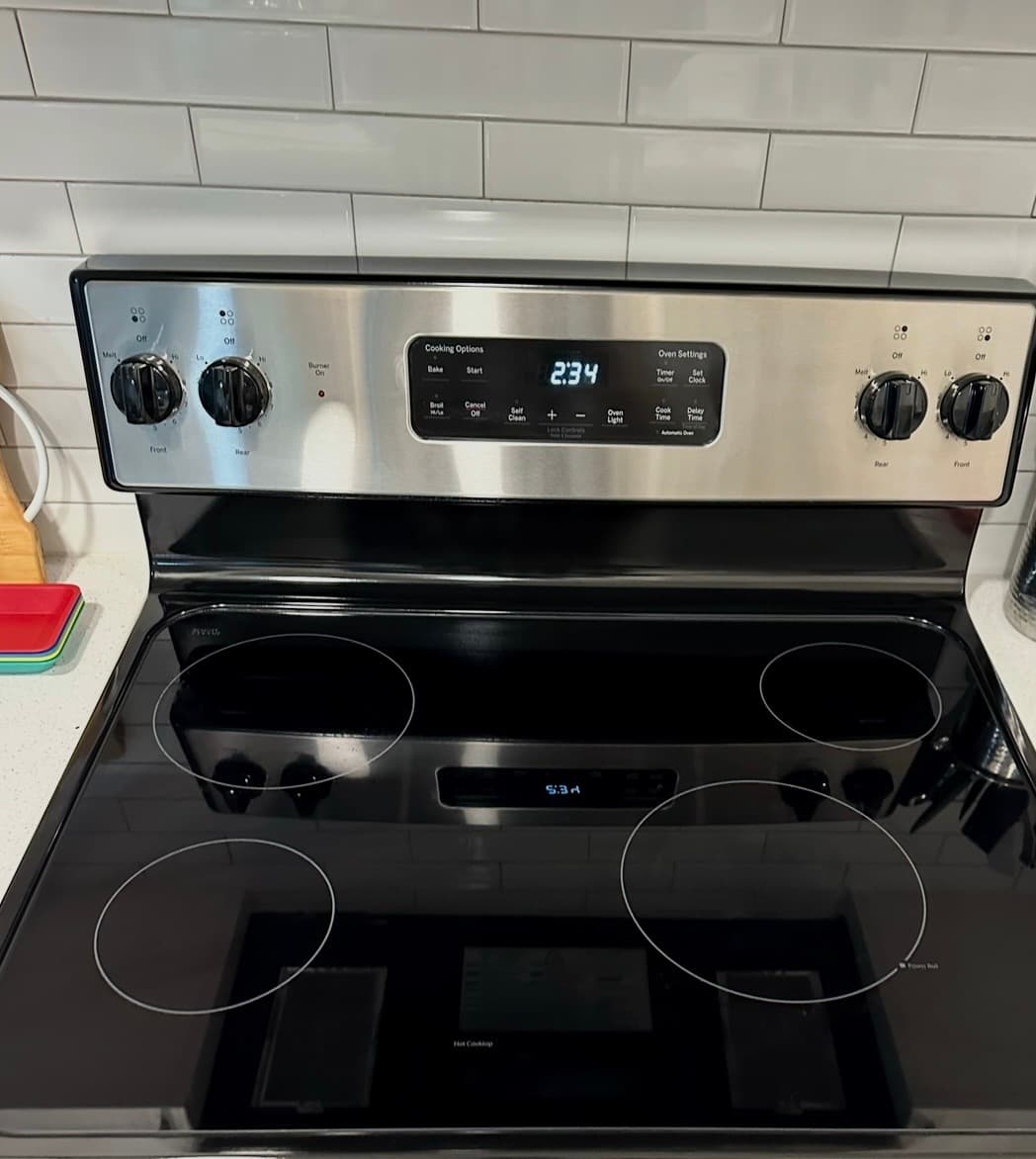 Home Cleaning in Kent, WA — Kitchen after cleaning: Polished glass surface, pristine knobs