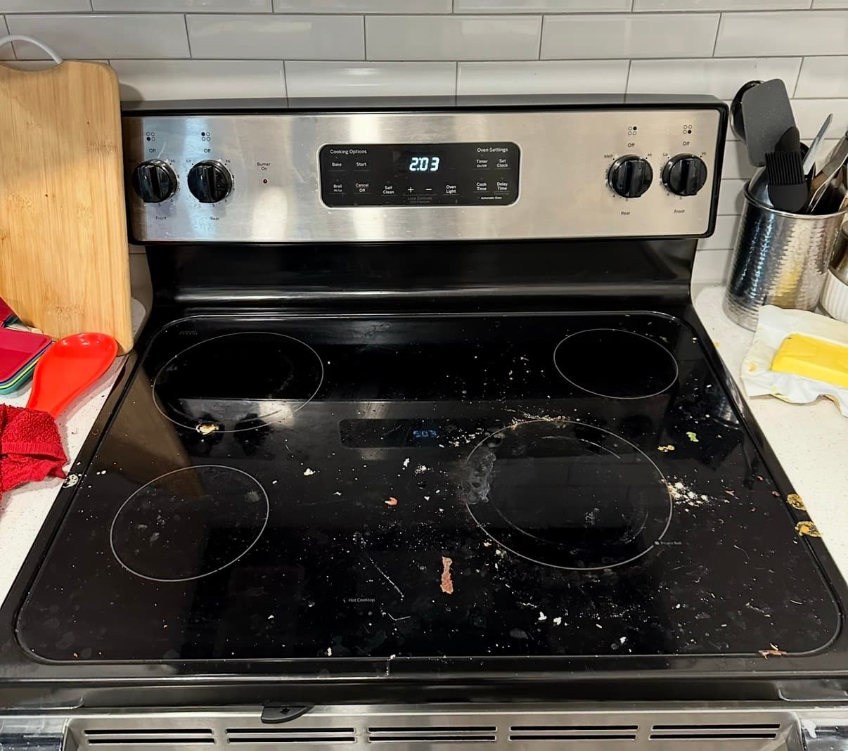Home Cleaning in Kent, WA — Kitchen before cleaning: Burned-on grease, scorched glass top