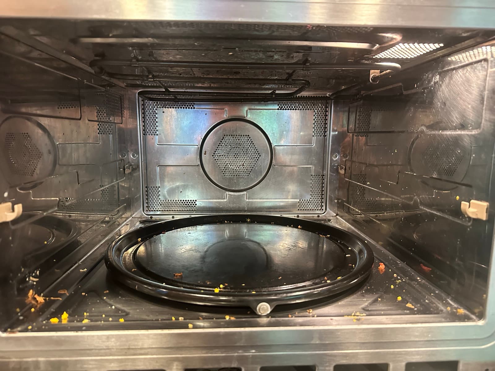 Home Cleaning in Bellevue, WA — Kitchen before cleaning: Carbonized spills, smoke residue