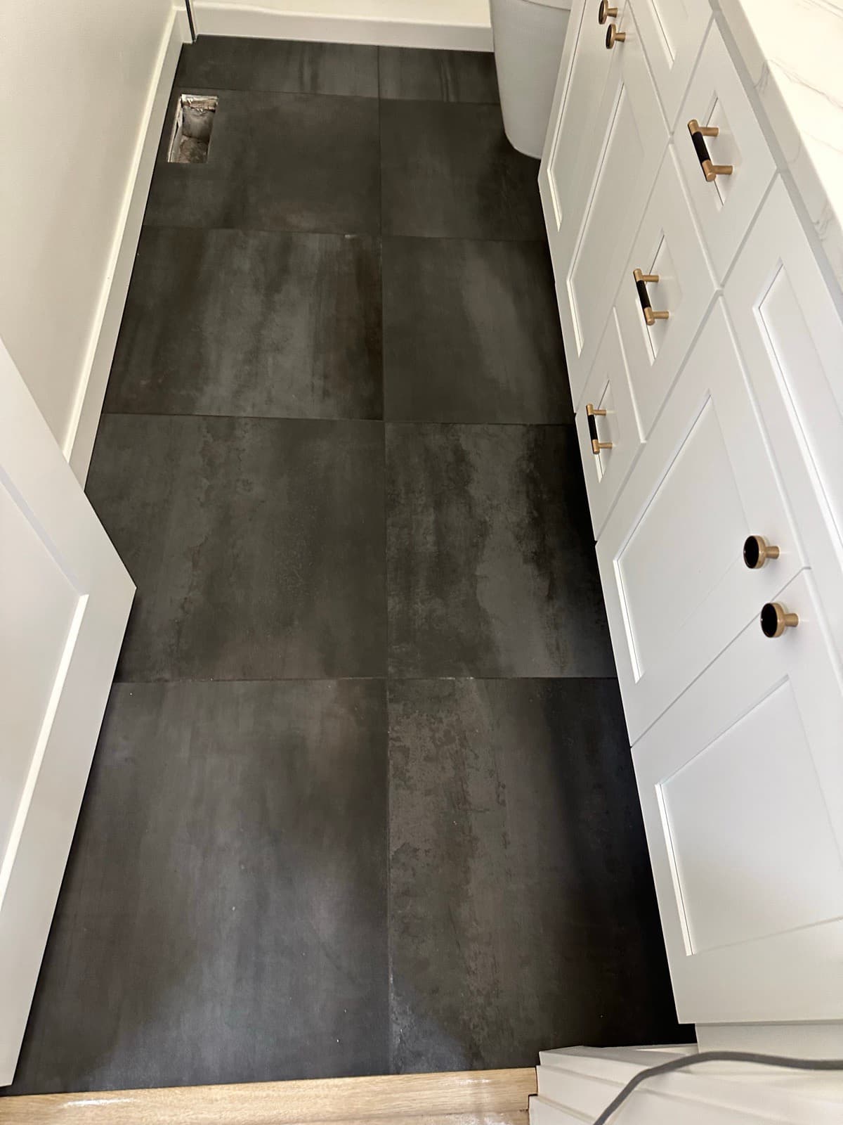 Home Cleaning in Kent, WA — Bathroom after cleaning: Grout brushed, tiles buffed clean