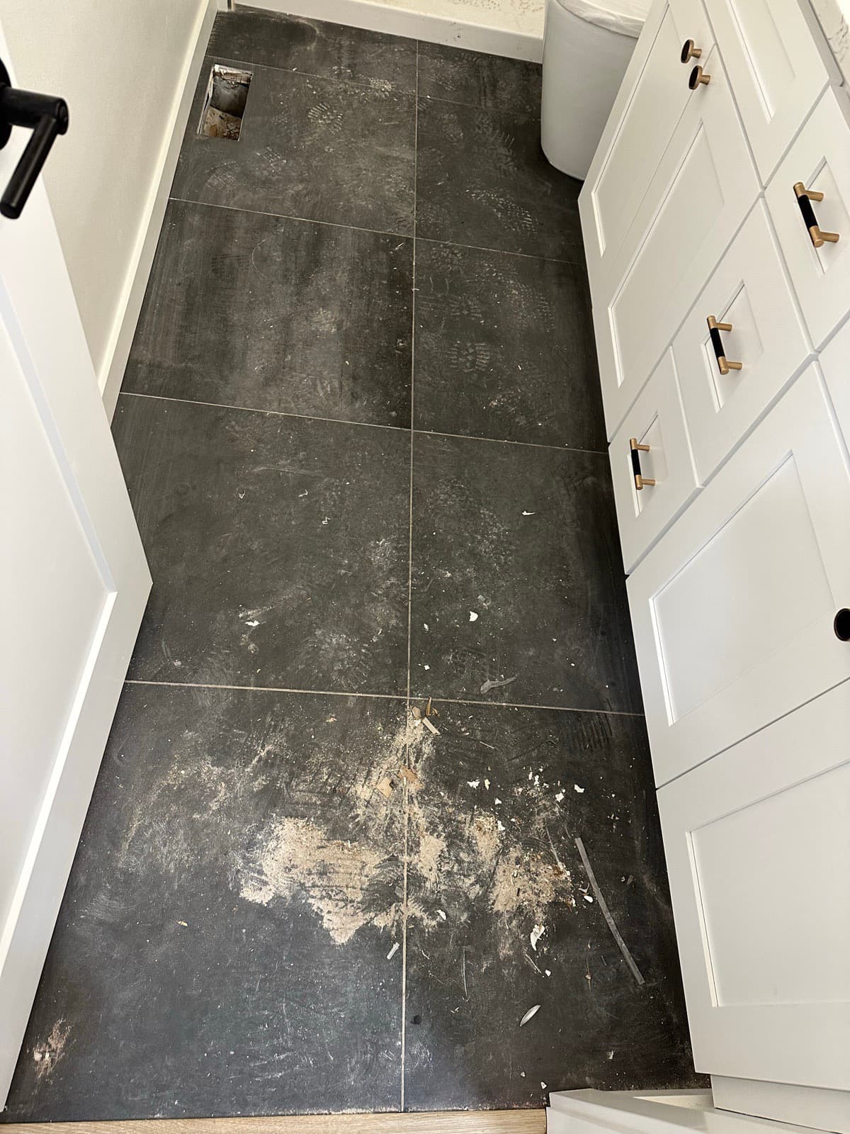 Home Cleaning in Kent, WA — Bathroom before cleaning: Grout darkened, footprint marks