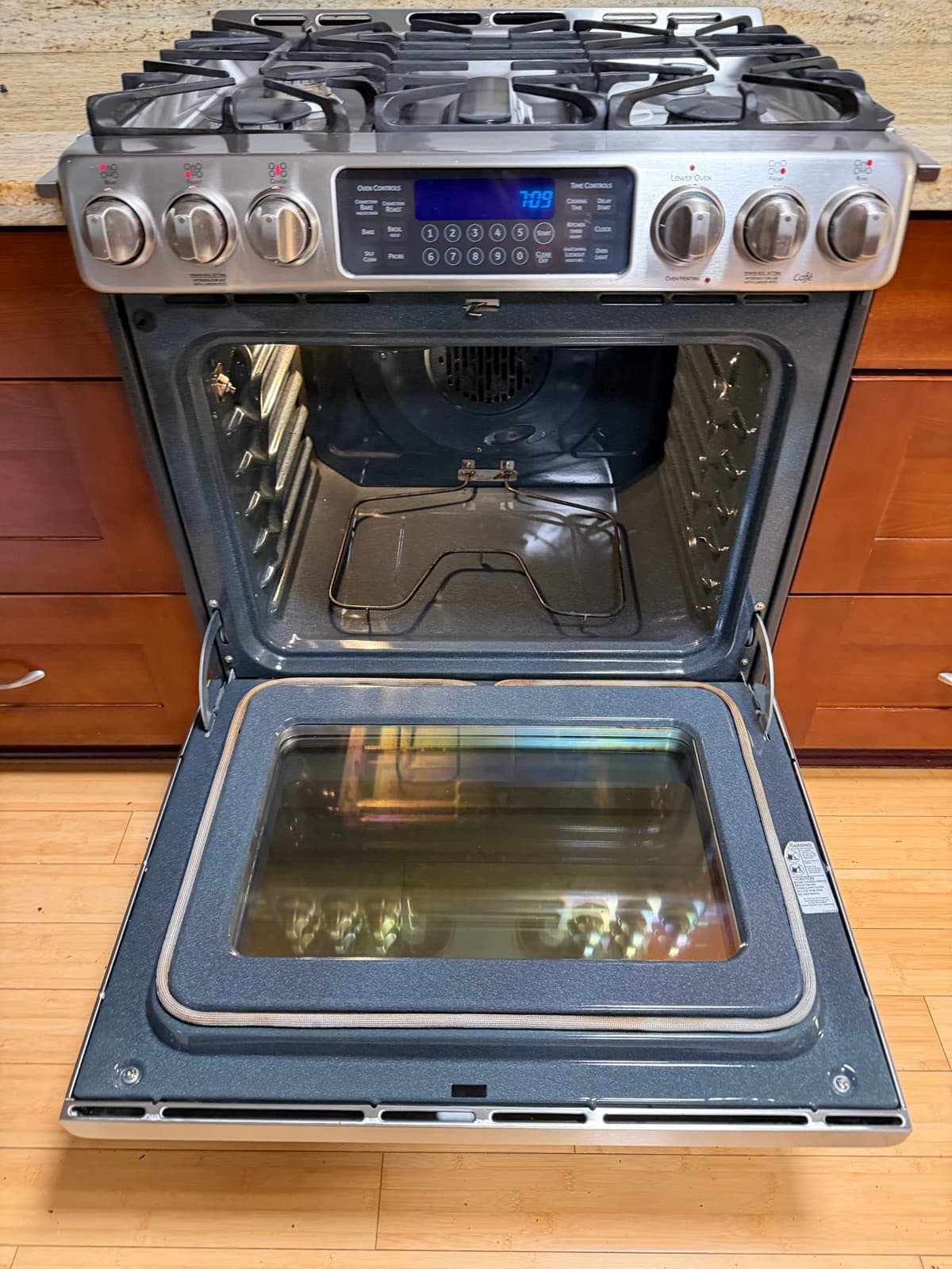 Home Cleaning in Tacoma, WA — Kitchen after cleaning: Door glass clear, racks degreased