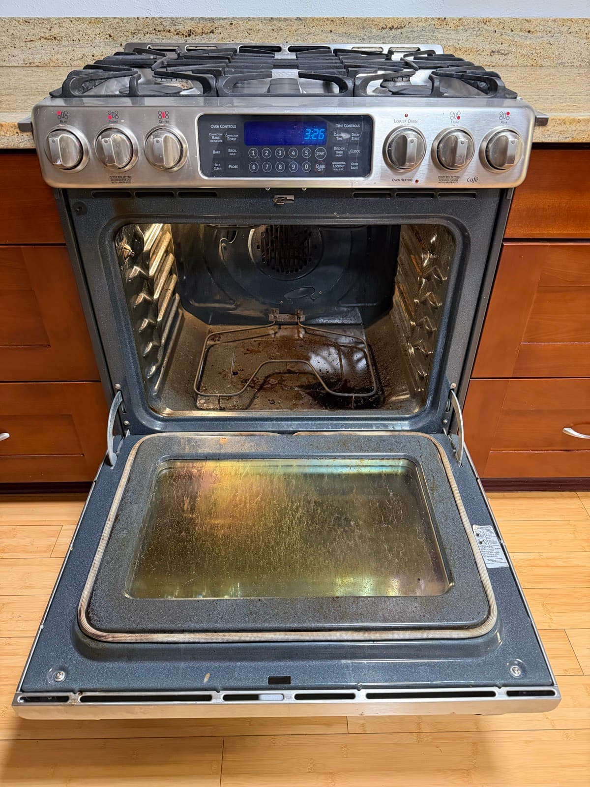 Home Cleaning in Tacoma, WA — Kitchen before cleaning: Baked-on grease, stained racks