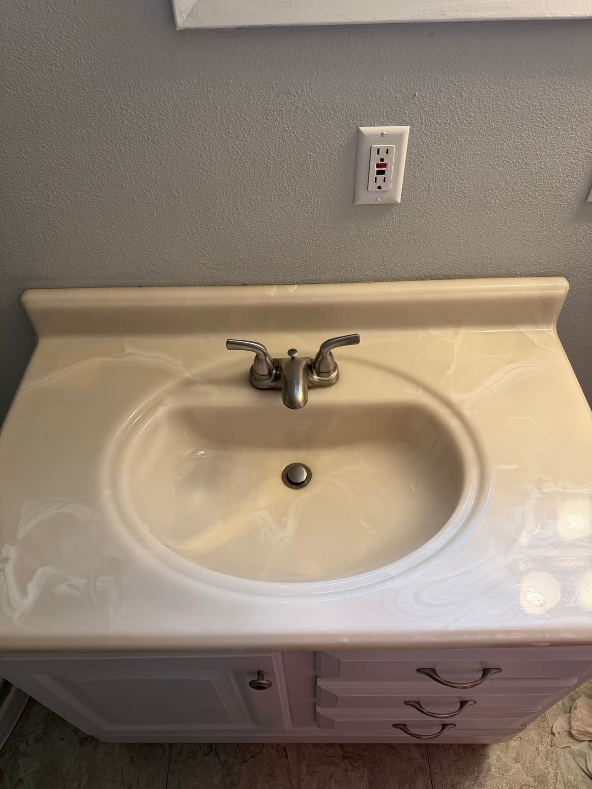Home Cleaning in Renton, WA — Bathroom after cleaning: Basin brightened, faucet polished