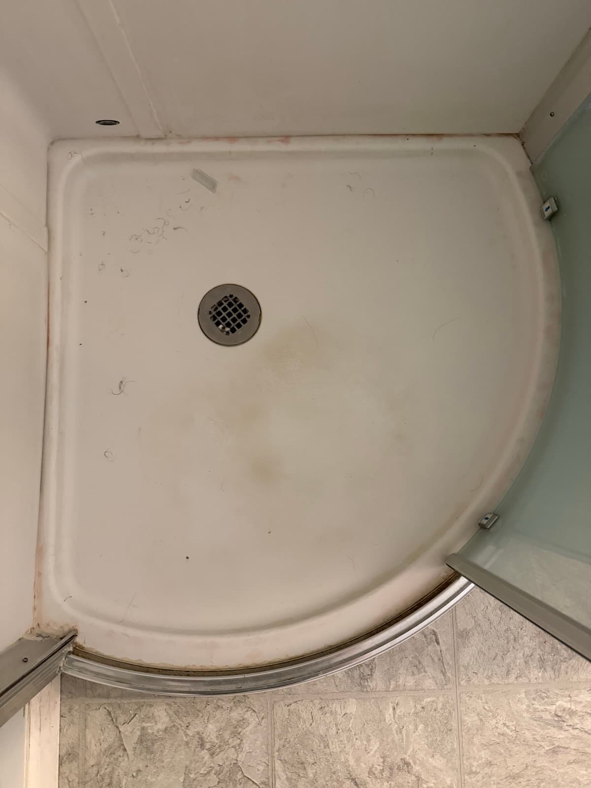 Home Cleaning in Kent, WA — Bathroom before cleaning: Soap scum, hair, mildewed corners
