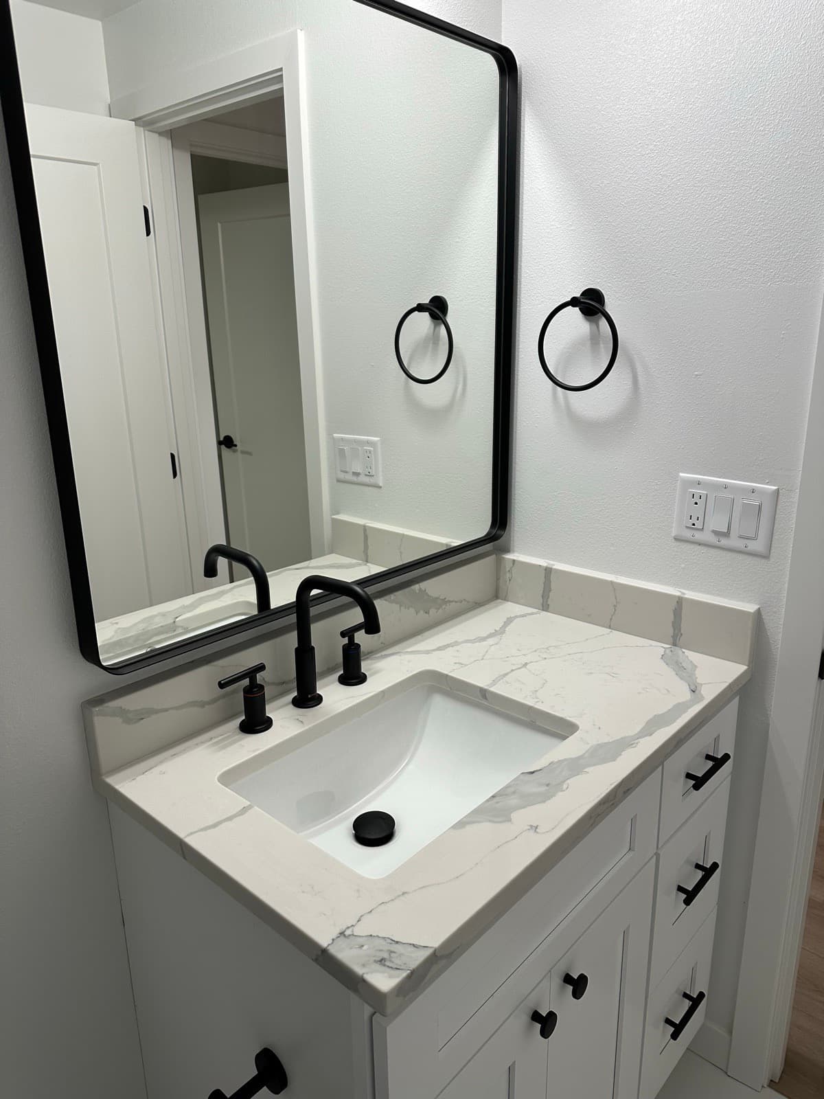 Home Cleaning in Bellevue, WA — Bathroom after cleaning: Counter polished, mirror streak-free